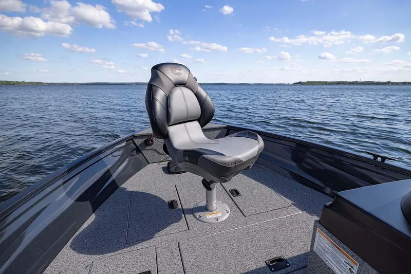 Slide: The Image of Manufacturer Provided Image: 2026 Crestliner 1650 Kodiak SC boat seat on a calm lake under a blue sky. - 15