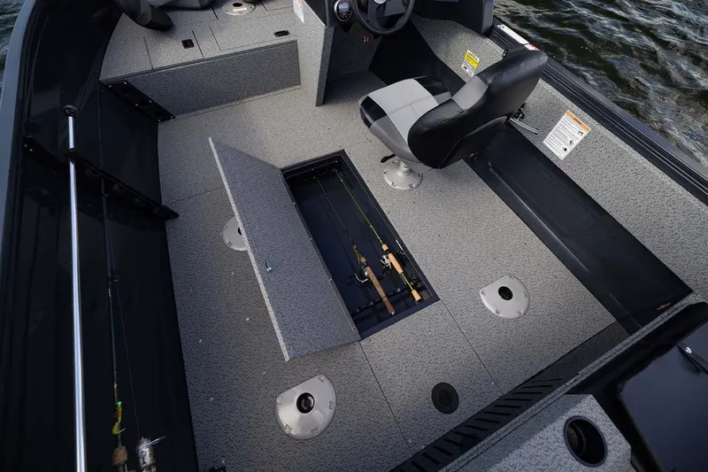 Slide: The Image of Manufacturer Provided Image: 2026 Crestliner 1650 Kodiak SC boat interior with rod storage and seating. - 17