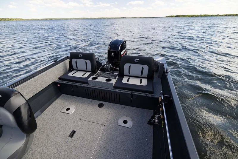 Slide: The Image of Manufacturer Provided Image: 2026 Crestliner 1650 Kodiak SC boat on a lake, featuring spacious seating and modern design. - 18