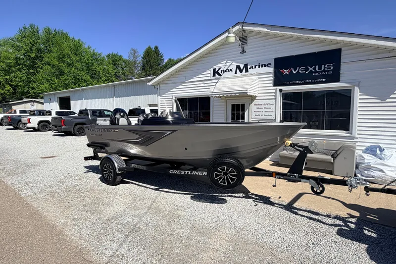 Slide: The Image of 2026 Crestliner 1650 Kodiak SC boat on trailer outside Knox Marine dealership. - 2
