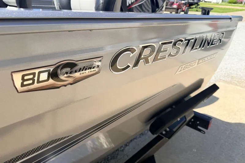 Slide: The Image of 2026 Crestliner 1650 Kodiak SC boat exterior with logo and branding details. - 9