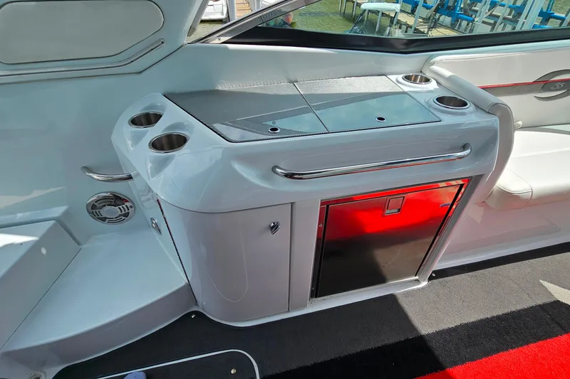 Slide: The Image of Interior of a 2013 Formula 310 FX5 boat featuring a sleek wet bar with cup holders. - 11