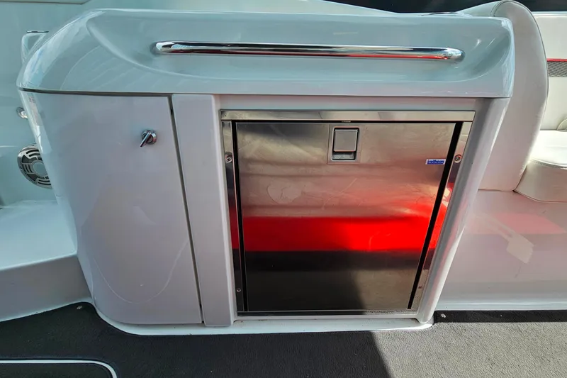 Slide: The Image of 2013 Formula 310 FX5 boat interior with stainless steel cabinet and seating. - 13