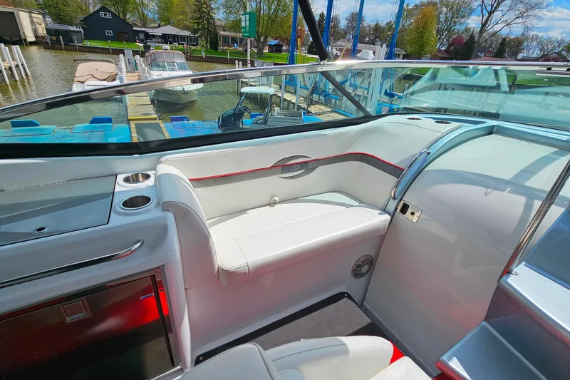Slide: The Image of Interior of a 2013 Formula 310 FX5 boat with white seating and cup holders. - 14