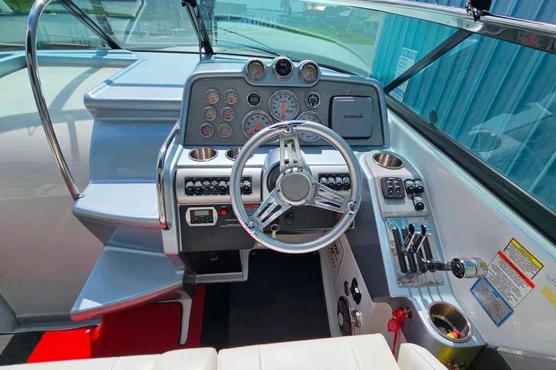Slide: The Image of Cockpit of 2013 Formula 310 FX5 boat with steering wheel and control panel. - 16