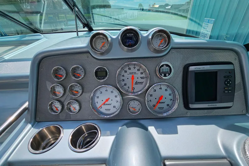 Slide: The Image of Dashboard of a 2013 Formula 310 FX5 boat with gauges and Garmin GPS. - 18
