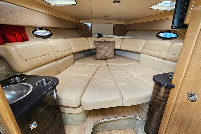 Slide: The Image of Luxurious interior of a 2013 Formula 310 FX5 boat with beige seating and modern amenities. - 25