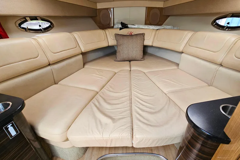 Slide: The Image of Luxurious interior of a 2013 Formula 310 FX5 boat with beige seating and cushion. - 29