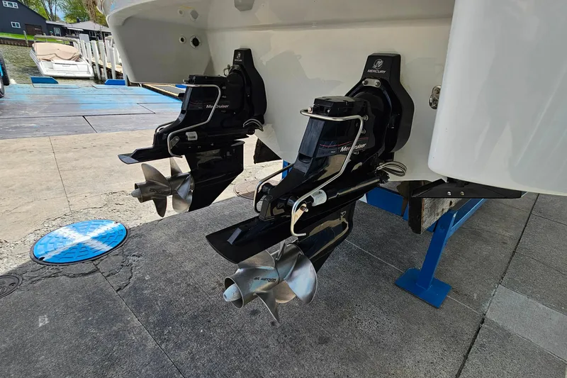 Slide: The Image of 2013 Formula 310 FX5 boat with dual MerCruiser outdrives on a dock. - 6