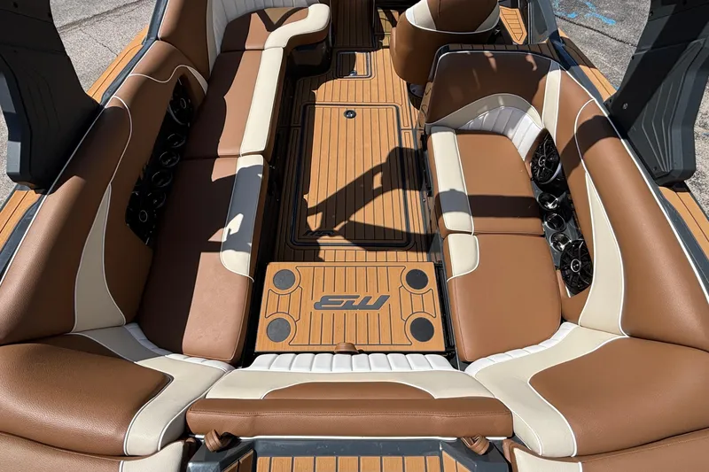 Slide: The Image of Luxurious interior of 2026 MB B52 23 Alpha boat with brown and cream seating. - 13