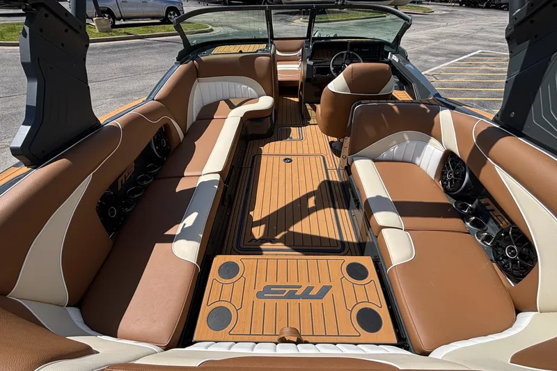 Slide: The Image of Luxurious interior of 2026 MB B52 23 Alpha boat with tan and white seating. - 14
