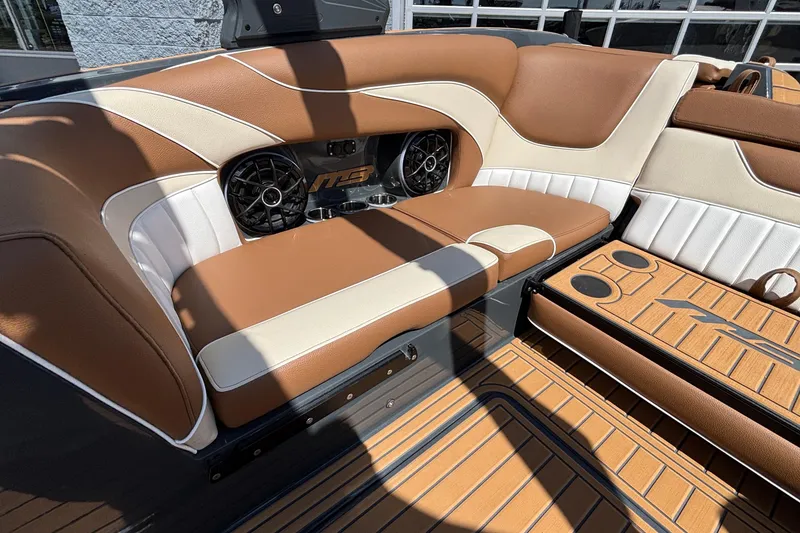 Slide: The Image of Luxurious interior of 2026 MB B52 23 Alpha boat with brown and white seating. - 20