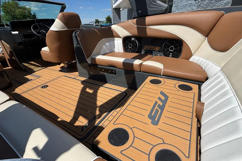 Slide: The Image of Luxurious interior of 2026 MB B52 23 Alpha boat with brown and white seating. - 24