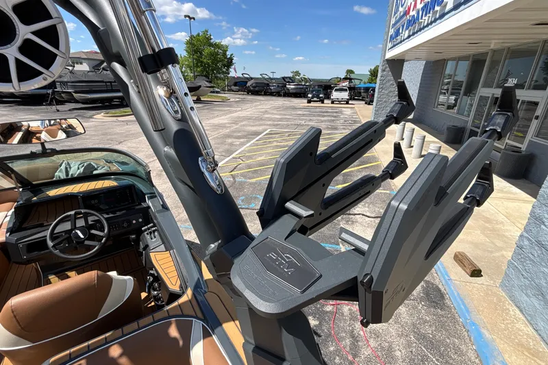 Slide: The Image of 2026 MB B52 23 Alpha boat interior with steering wheel and wakeboard rack. - 28