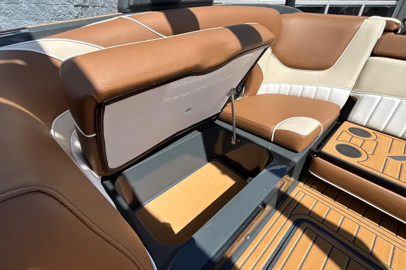 Slide: The Image of Luxurious interior of 2026 MB B52 23 Alpha boat with storage compartment open. - 31
