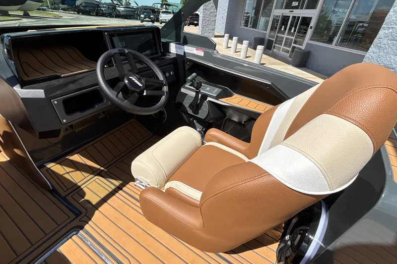 Slide: The Image of 2026 MB B52 23 Alpha boat interior with tan leather seats and modern dashboard. - 38