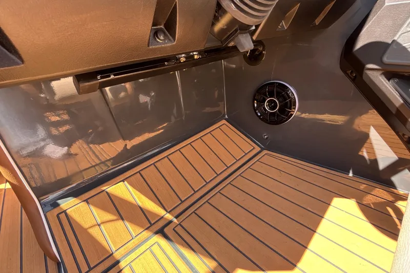 Slide: The Image of 2026 MB B52 23 Alpha interior with wood flooring and speaker detail. - 44