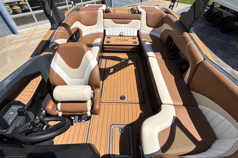 Slide: The Image of Luxurious interior of 2026 MB B52 23 Alpha boat with brown and white seating. - 47