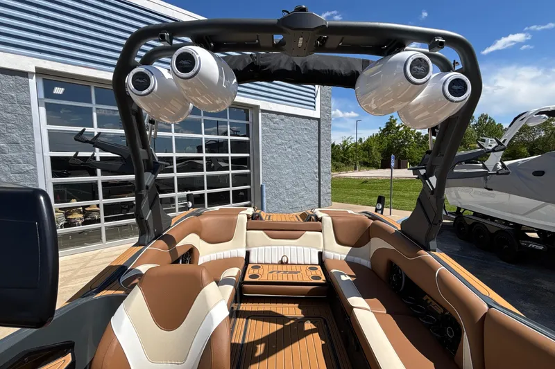 Slide: The Image of 2026 MB B52 23 Alpha boat interior with premium seating and advanced audio system. - 48