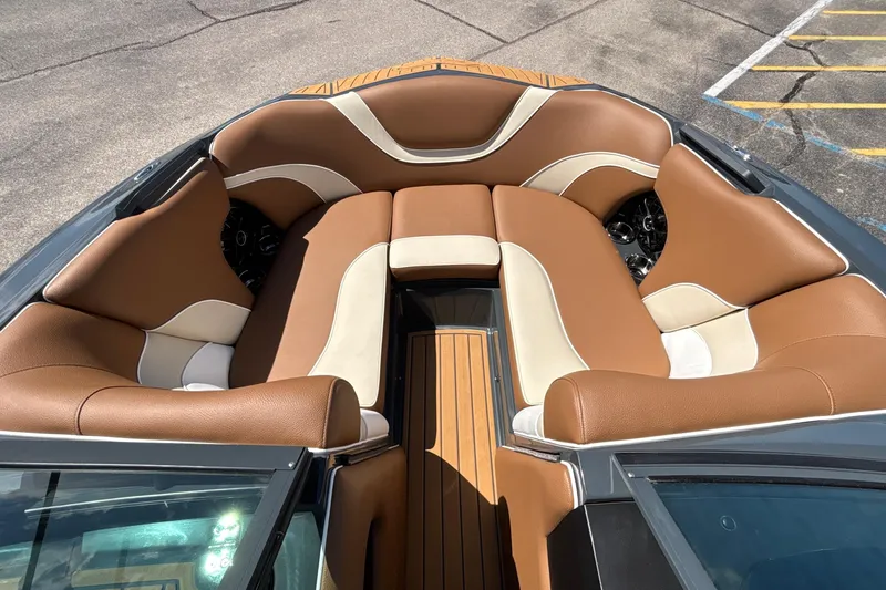 Slide: The Image of Luxurious interior of 2026 MB B52 23 Alpha boat with brown and cream seating. - 53