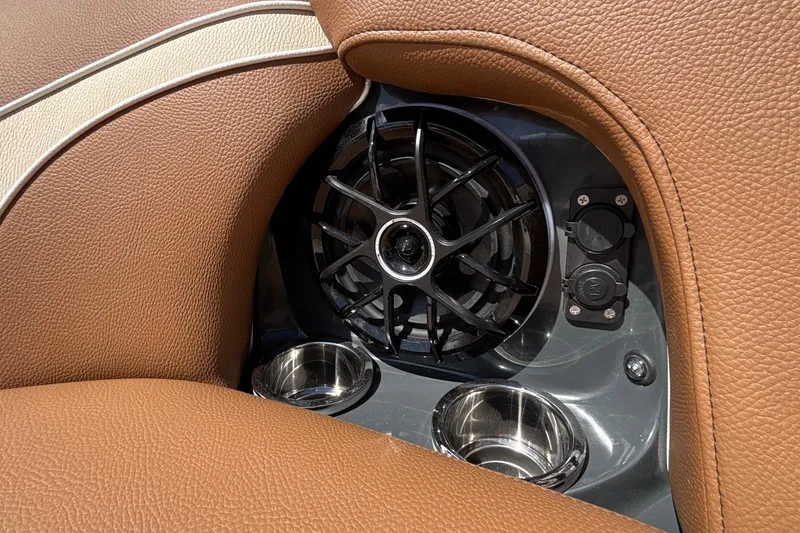 Slide: The Image of Brown leather interior with speaker and cup holders in 2026 MB B52 23 Alpha. - 56