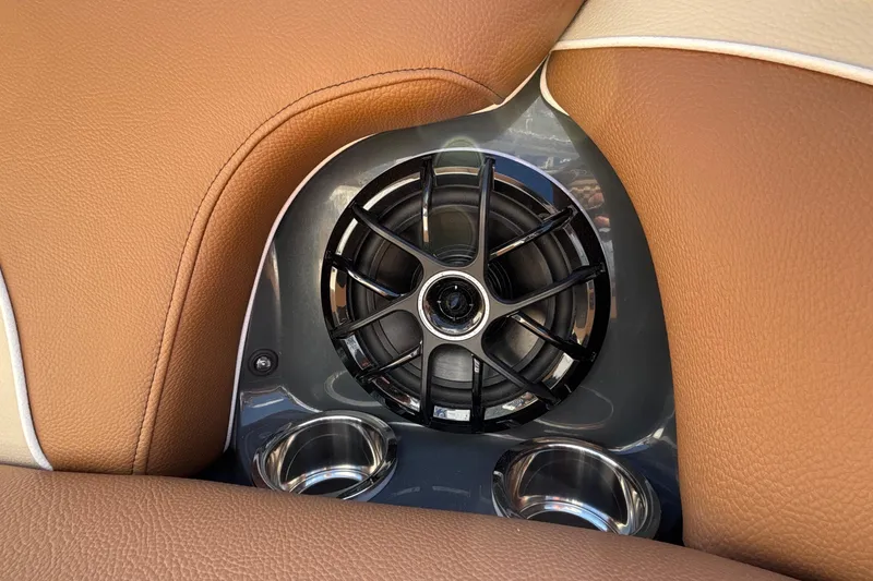 Slide: The Image of Brown leather interior with speaker and cup holders in 2026 MB B52 23 Alpha. - 57