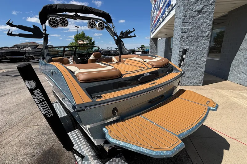 Slide: The Image of 2026 MB B52 23 Alpha boat with sleek design and premium seating, displayed outdoors. - 6