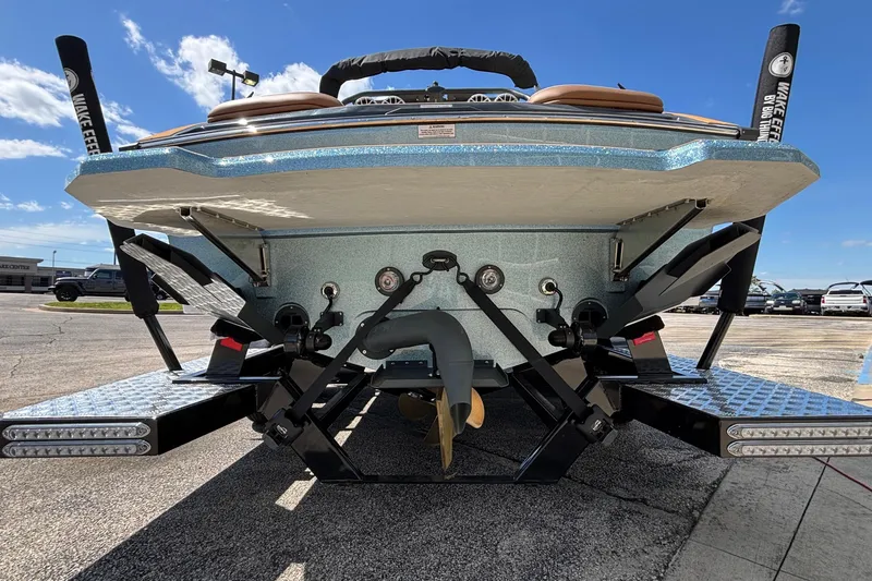 Slide: The Image of 2026 MB B52 23 Alpha boat rear view, showcasing wakeboard features and propeller. - 7