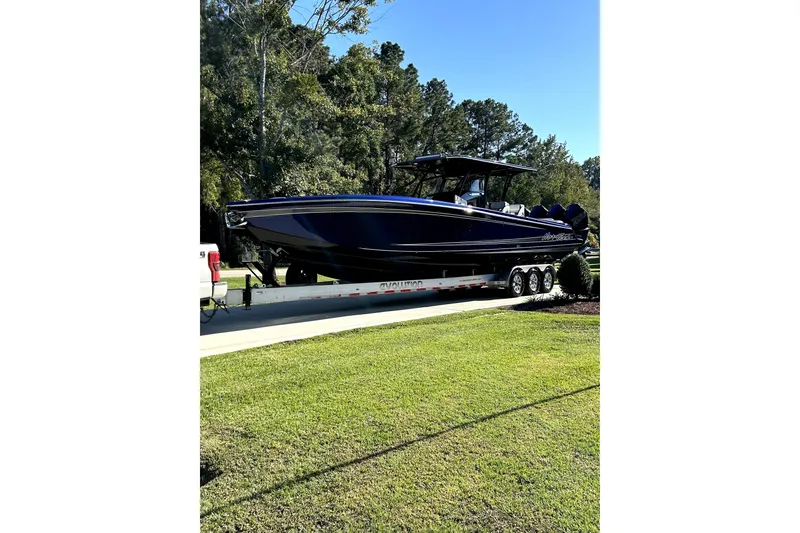 Slide: The Image of 2021 Nortech 390 Sport boat on trailer, parked on a sunny driveway. - 3