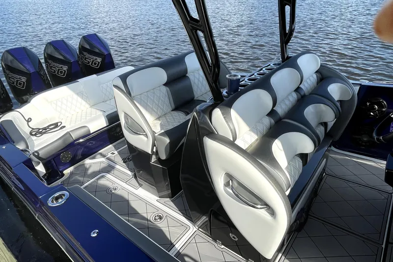 Slide: The Image of 2021 Nortech 390 Sport boat interior with luxurious seating and powerful Mercury 450 engines. - 6