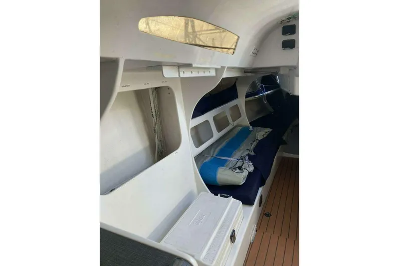 Slide: The Image of Interior of a 1995 Nelson Marek 46 sailboat, featuring storage and seating areas. - 12