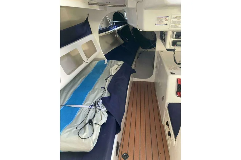 Slide: The Image of Interior of a 1995 Nelson Marek 46 sailboat, featuring a compact cabin layout. - 13