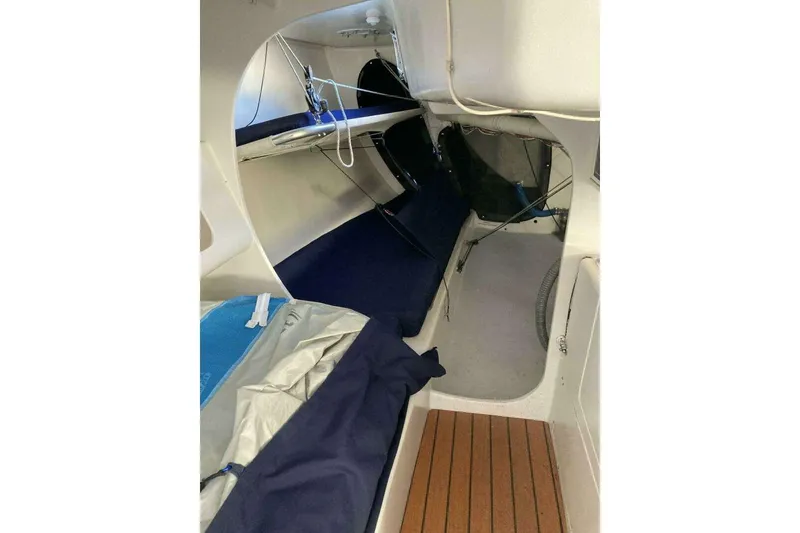 Slide: The Image of Interior of a 1995 Nelson Marek 46 sailboat, featuring a compact cabin layout. - 14