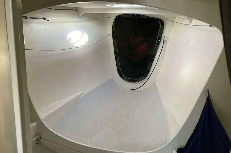 Slide: The Image of Interior of a 1995 Nelson Marek 46 sailboat, featuring a sleek, minimalist cabin design. - 19