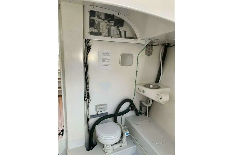 Slide: The Image of Interior of a 1995 Nelson Marek 46 yacht bathroom with toilet and sink. - 20