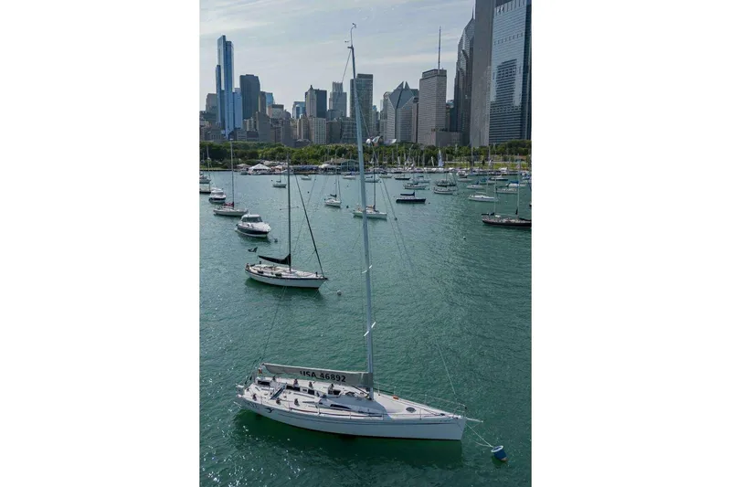Slide: The Image of Sailboats on a city waterfront, featuring a 1995 Nelson Marek 46. - 3