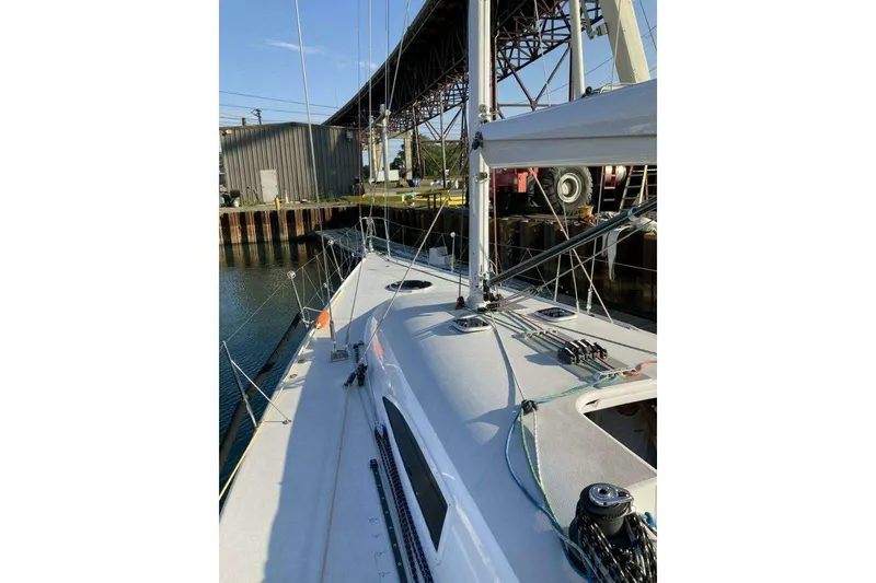 Slide: The Image of Sailboat deck view of 1995 Nelson Marek 46 under a bridge. - 4