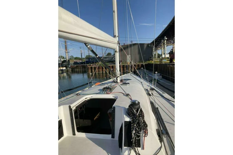 Slide: The Image of Sailboat deck view of 1995 Nelson Marek 46, docked in a marina. - 6