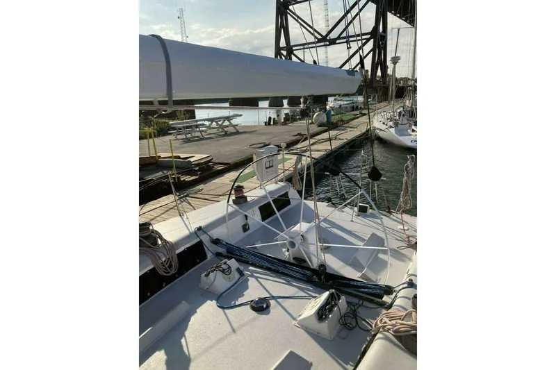 Slide: The Image of Sailboat docked at marina, Nelson Marek 46, 1995 model, with visible rigging and deck. - 9