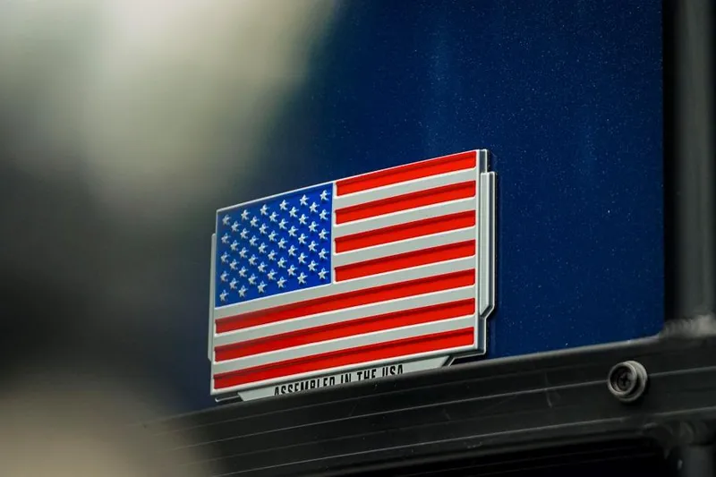 Slide: The Image of American flag emblem on 2026 Trifecta LE 22RF, "Assembled in the USA." - 10