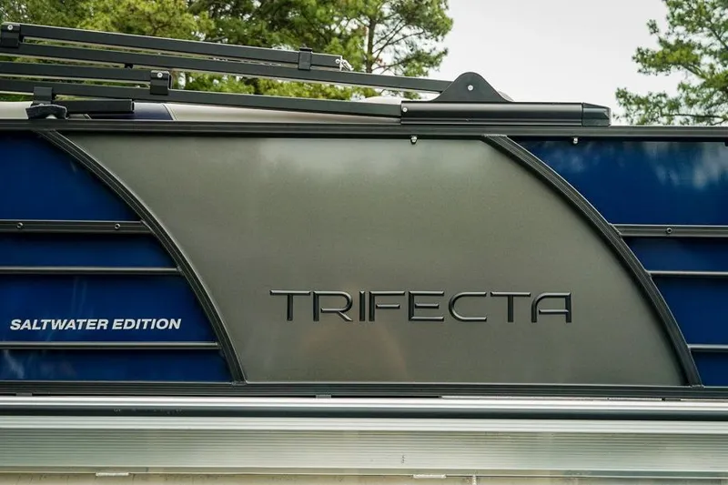 Slide: The Image of 2026 Trifecta LE 22RF Saltwater Edition boat, sleek design with blue and gray accents. - 13