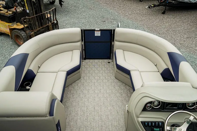 Slide: The Image of 2026 Trifecta LE 22RF pontoon boat interior with plush seating and modern dashboard. - 16