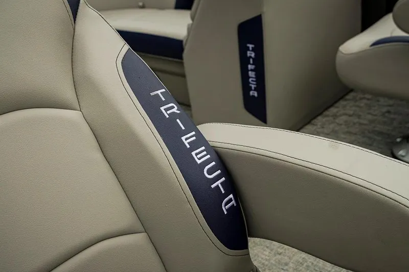 Slide: The Image of 2026 Trifecta LE 22RF boat interior with branded beige and navy seating. - 18