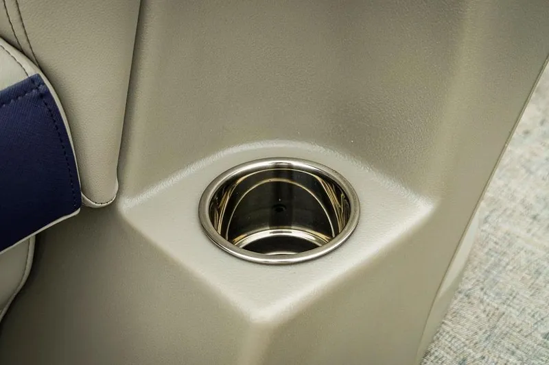 Slide: The Image of Cup holder in 2026 Trifecta LE 22RF boat interior, featuring sleek design and beige upholstery. - 23