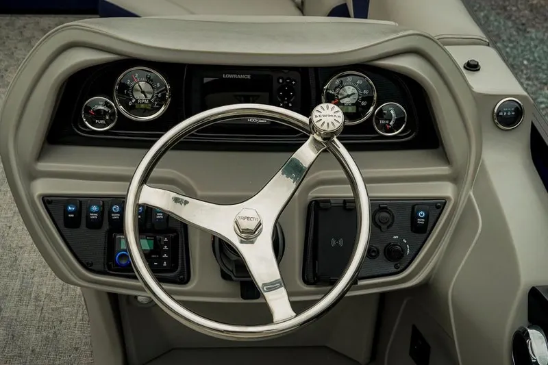 Slide: The Image of Steering console of 2026 Trifecta LE 22RF boat with gauges and controls. - 24