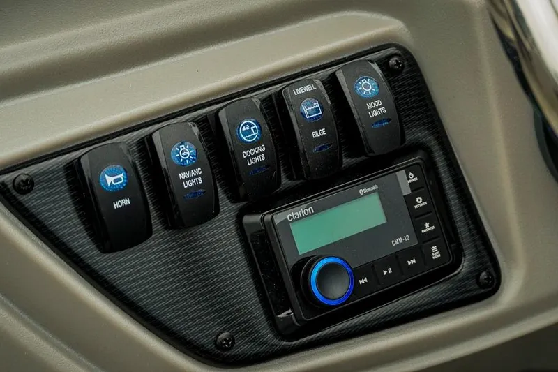 Slide: The Image of Control panel of 2026 Trifecta LE 22RF with switches and Clarion audio system. - 28