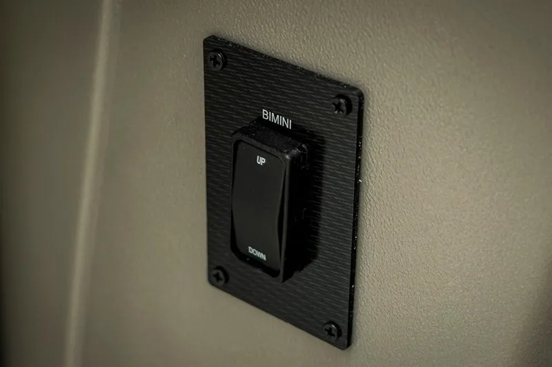Slide: The Image of Bimini switch on 2026 Trifecta LE 22RF boat, labeled "UP" and "DOWN." - 33