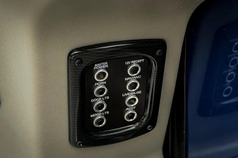 Slide: The Image of Control panel of 2026 Trifecta LE 22RF boat with various switches and functions. - 34