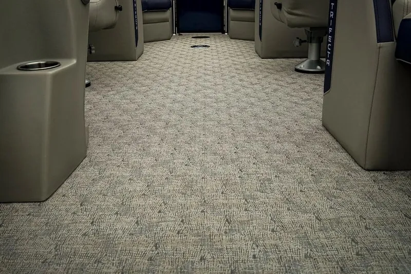 Slide: The Image of Interior of 2026 Trifecta LE 22RF boat with patterned carpet and seating. - 41