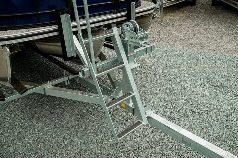 Slide: The Image of Trailer ladder and winch system for 2026 Trifecta LE 22RF boat on gravel surface. - 45